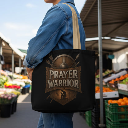 Black tote bag with "Prayer Warrior" text and shield emblem.