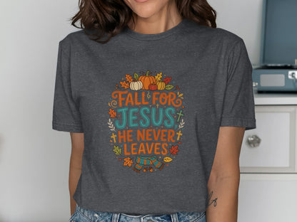 Dark grey t-shirt with "Fall for Jesus, He Never Leaves" text and autumn graphics.