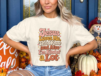 Cream t-shirt with text "Jesus Loves Me, This I Know and Also I'm Kind of a Lot".