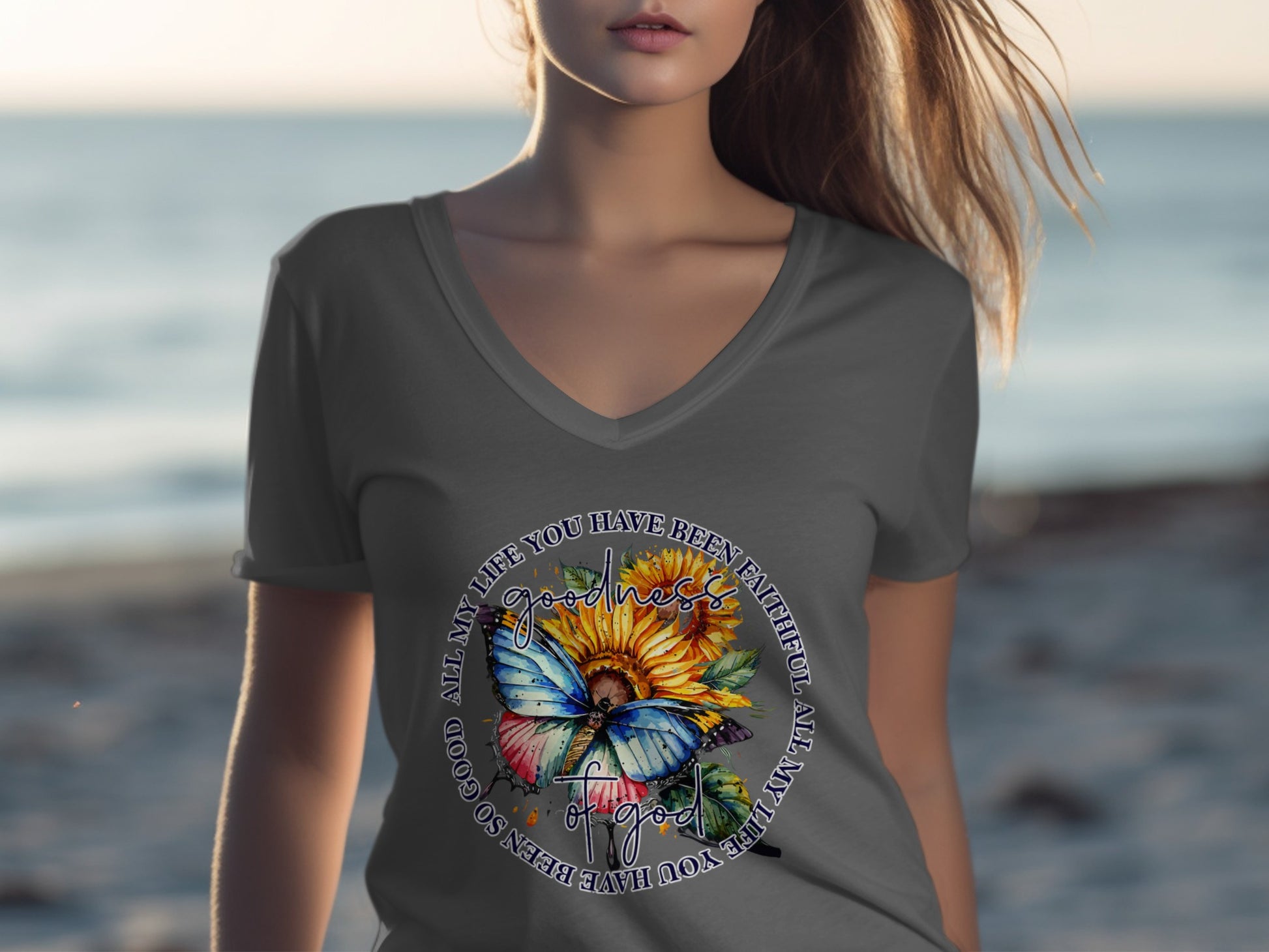 Gray v-neck t-shirt with a circular graphic of a butterfly and sunflowers.