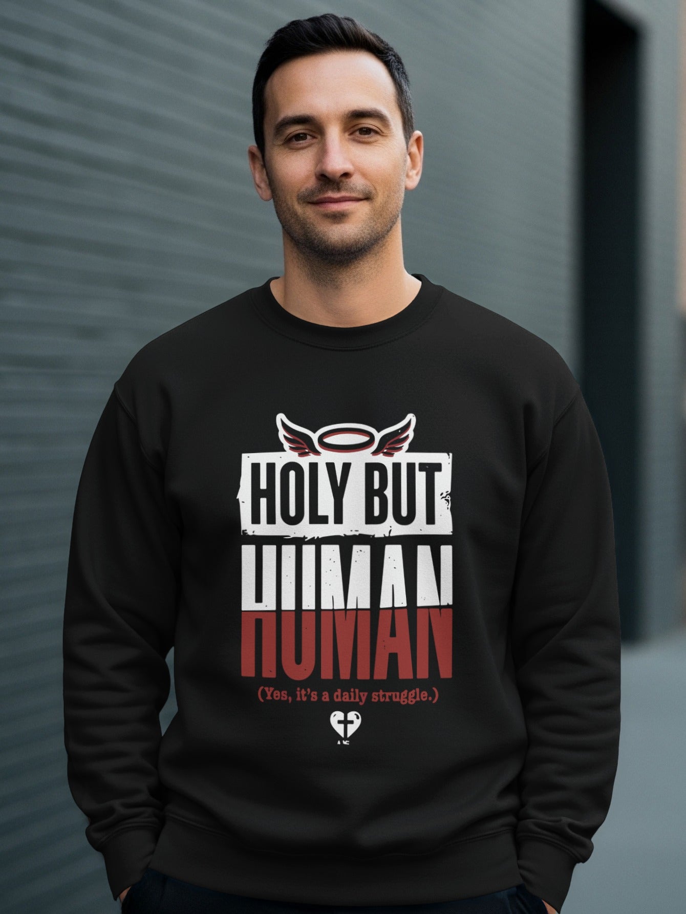 Black sweatshirt with "Holy But Human (Yes, it's a daily struggle)" graphic.