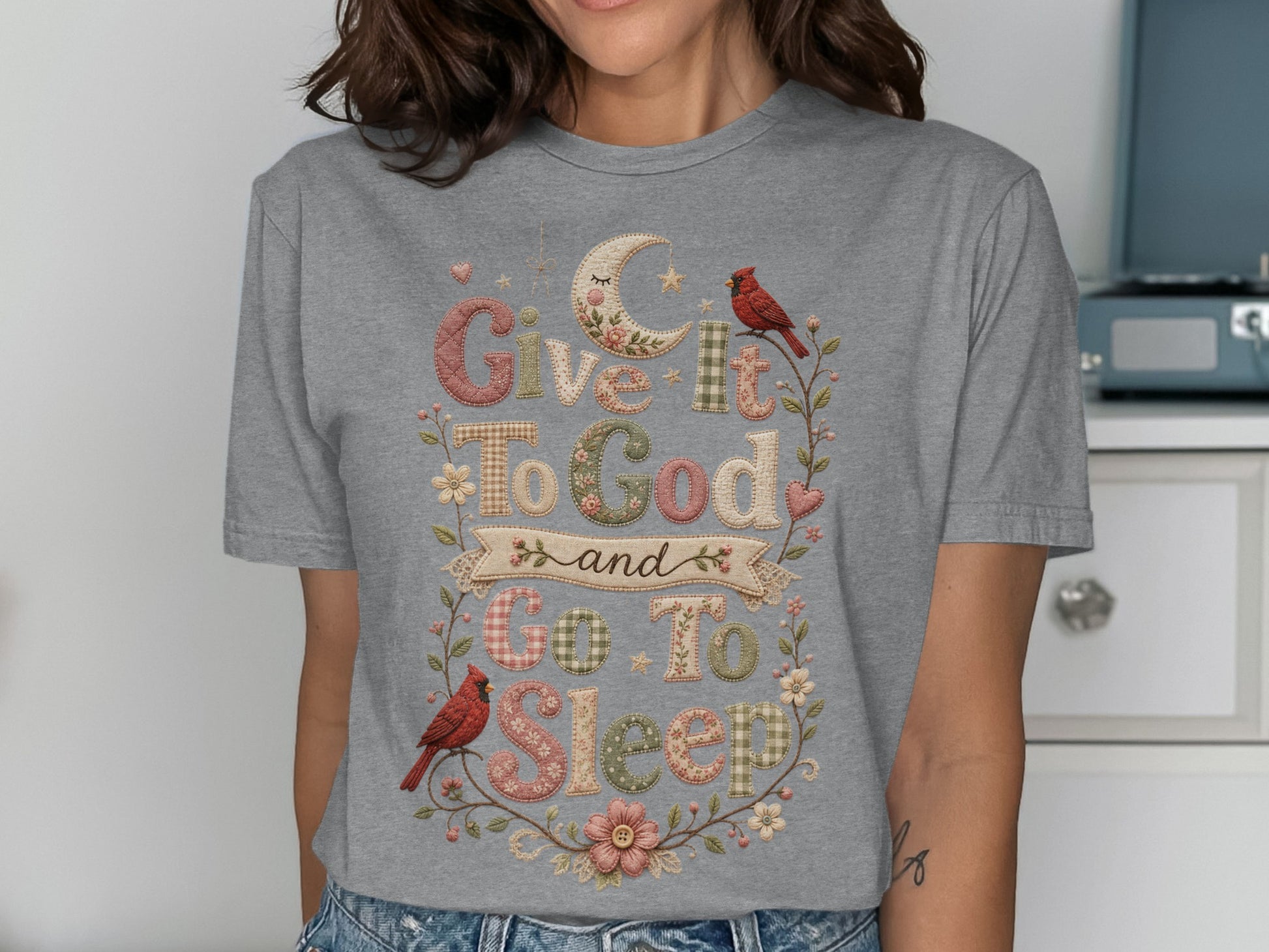 Gray t-shirt with "Give It To God and Go To Sleep" text and bird/floral accents.