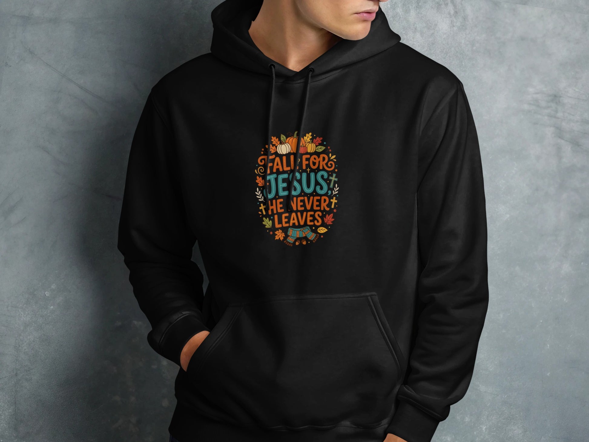 Black hoodie with "Fall For Jesus" text and fall-themed graphics.