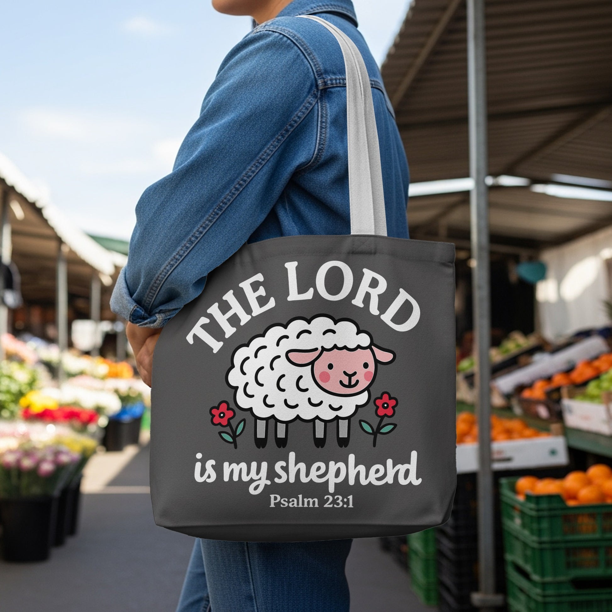 Dark gray tote bag with a white sheep and text "The Lord is my shepherd" Psalm 23:1.