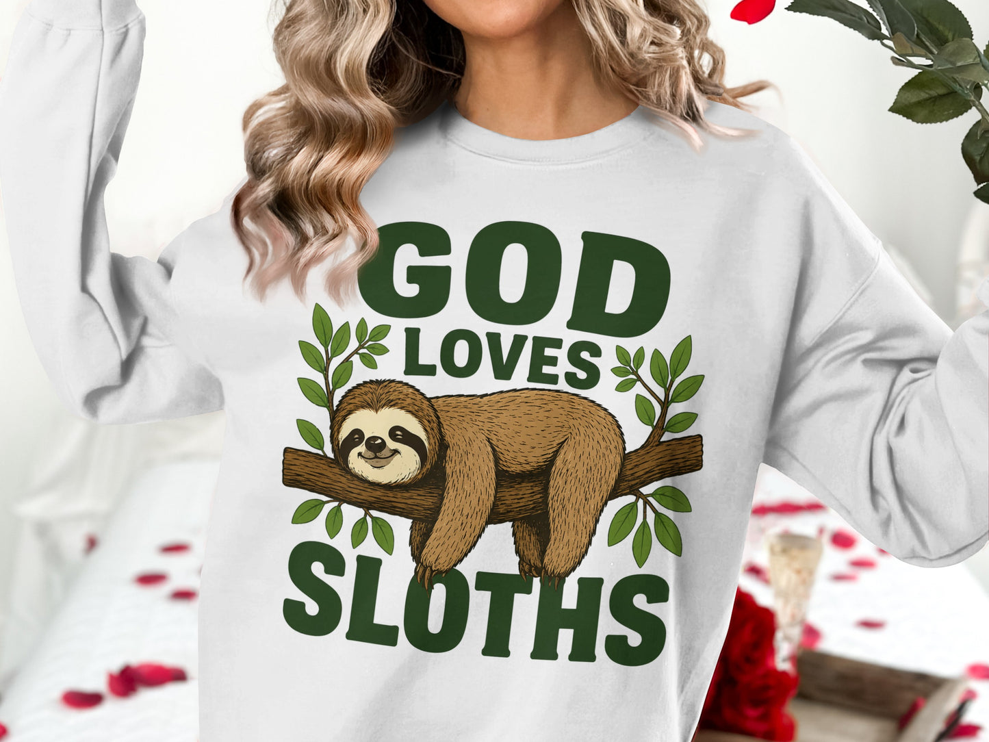 White sweatshirt with "God Loves Sloths" text and a sloth on a branch.