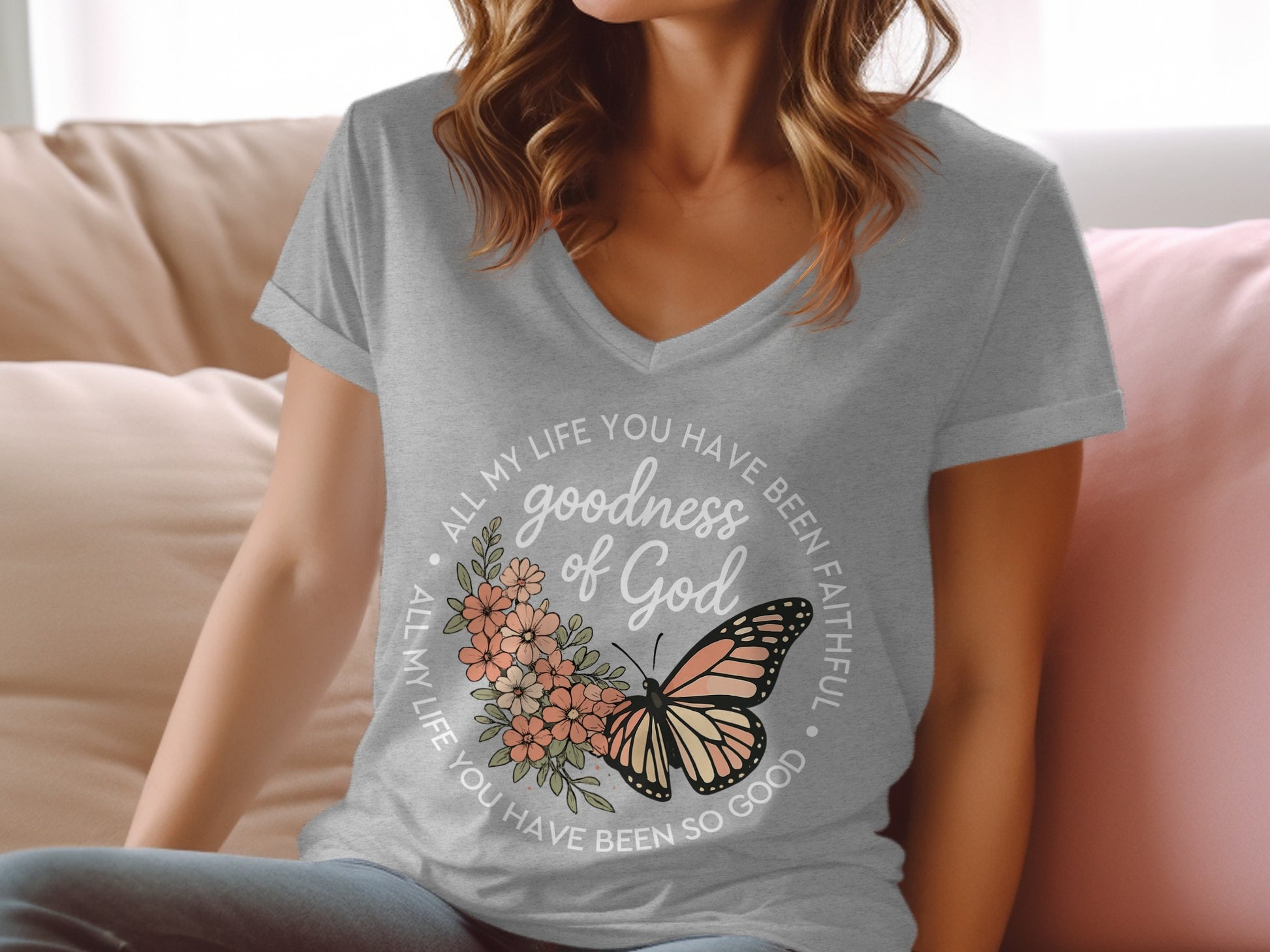 Grey t-shirt with "goodness of God" and butterfly graphic.