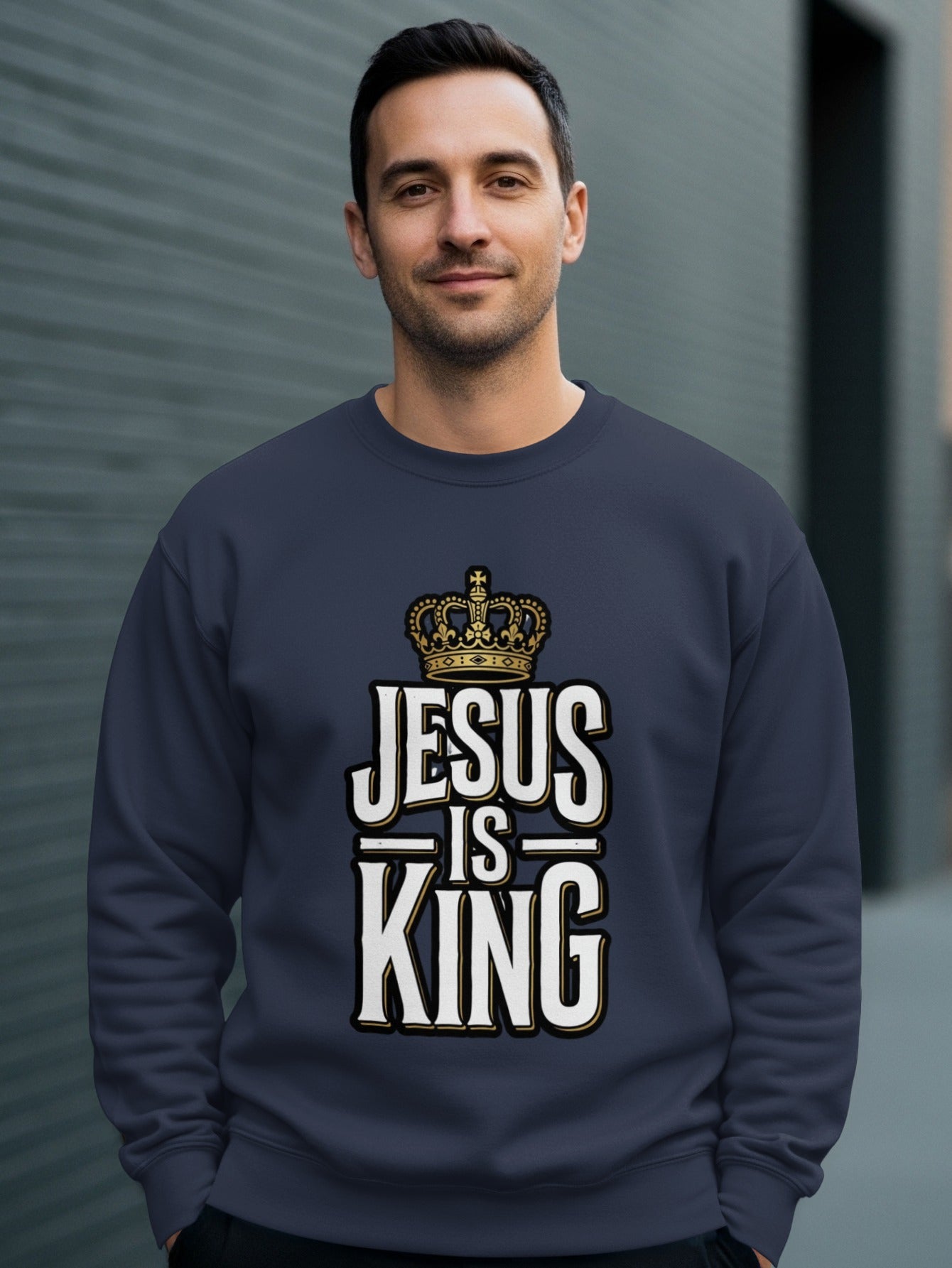 Navy sweatshirt with "Jesus is King" text and crown graphic.