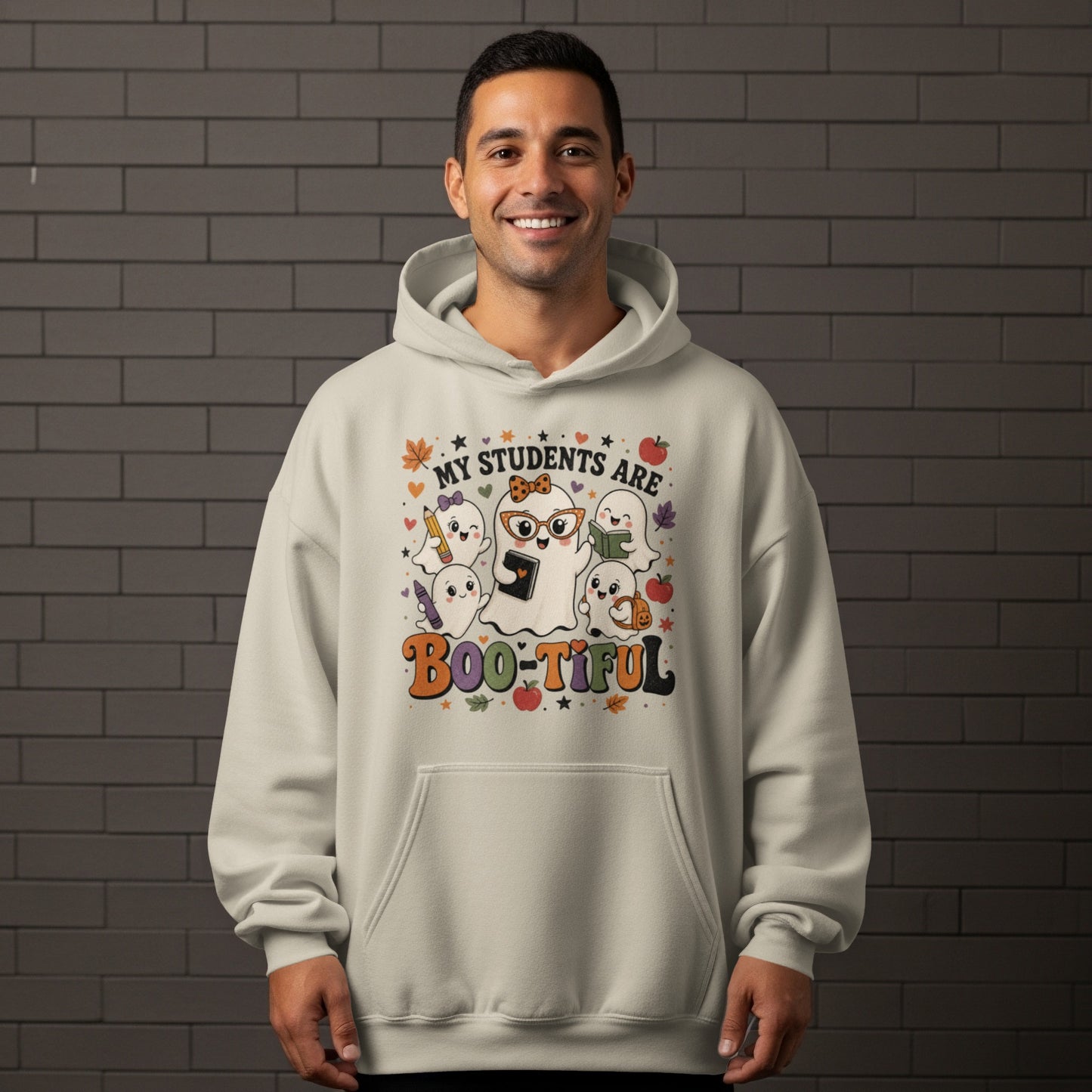 Cream hoodie with "My Students Are Boo-tiful" text and cute ghosts holding school supplies.