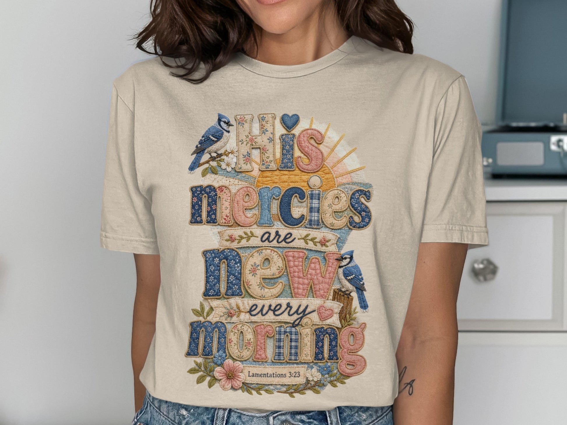 Beige t-shirt with "His Mercies Are New Every Morning" text and bluebirds.