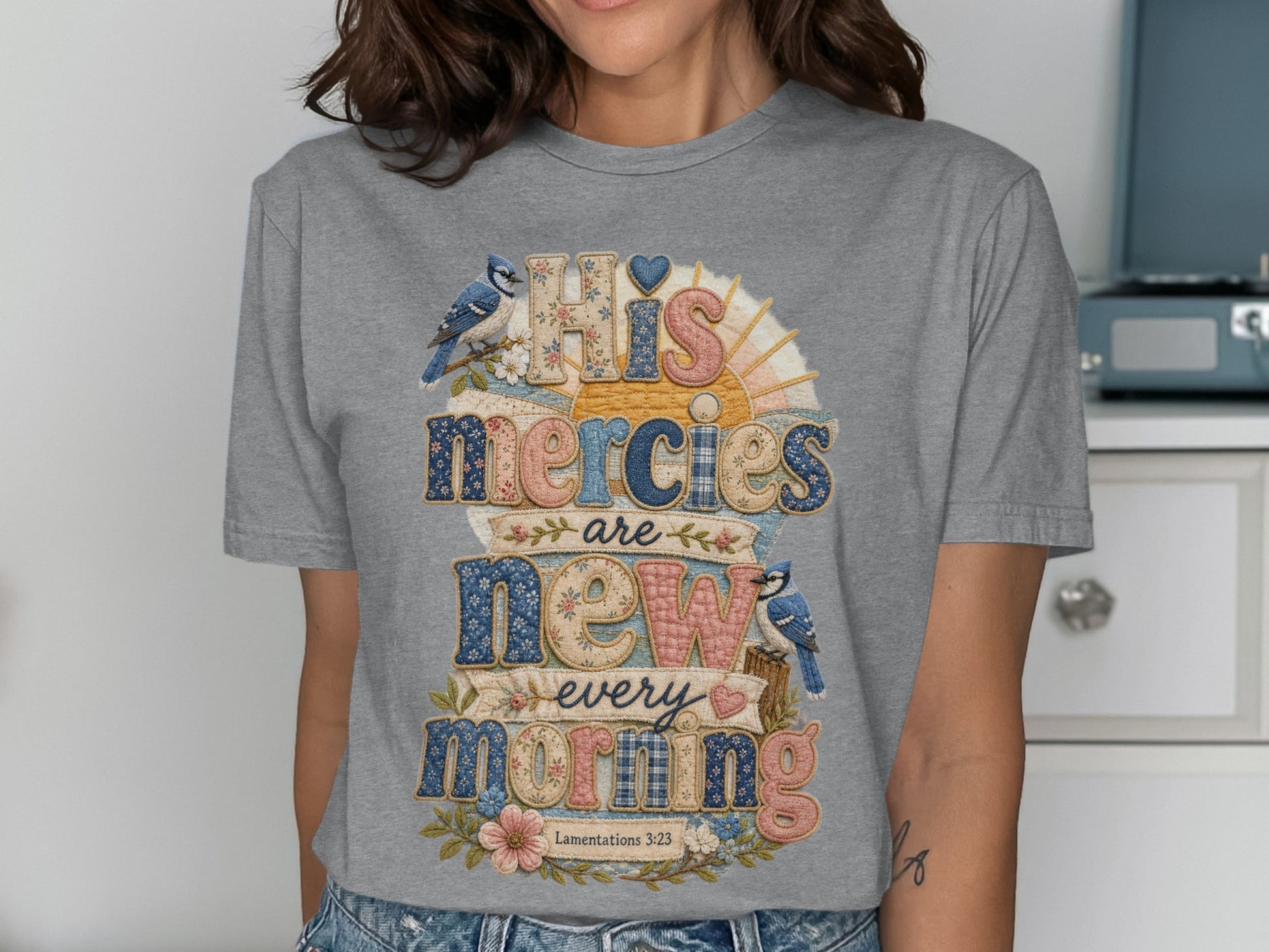 Gray t-shirt with "His mercies are new every morning" and Lamentations 3:23.